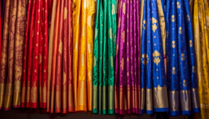 Home beautiful collection of vibrant silk sarees hanging on display, rich colors 20260519 132529 0000