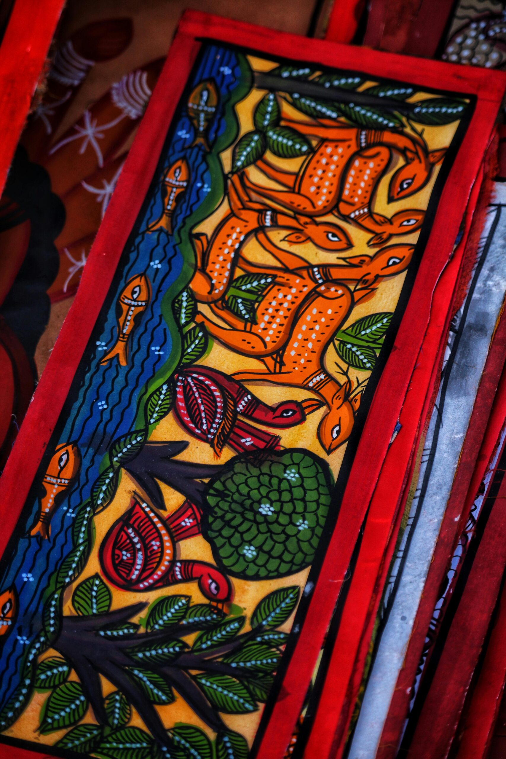 Colorful folk art painting featuring animals and nature elements with vibrant details.
